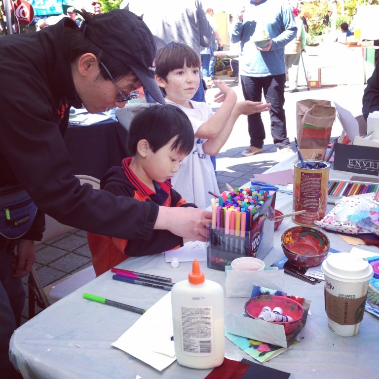 youth and dad making art together