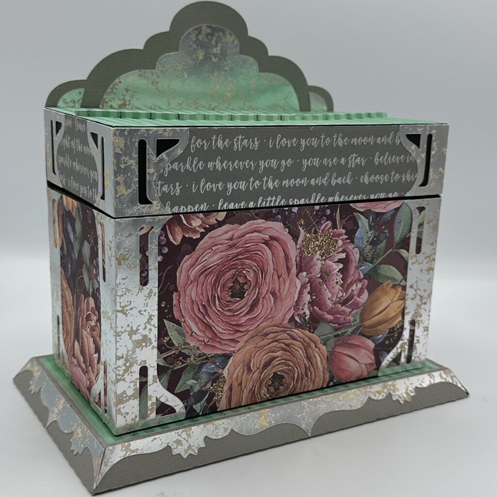a grey-ish colored cardboard box with flowers on the front