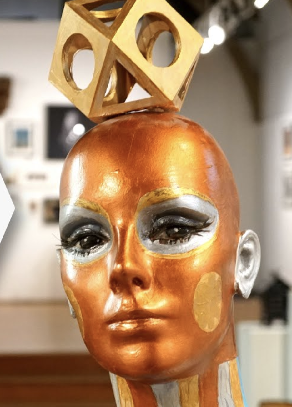 Face and head of bronze painted mannequin