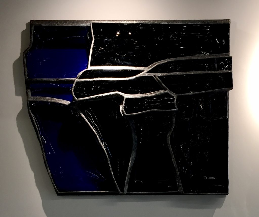 Opaque black and transluscent blue glass and steele wall sculpture