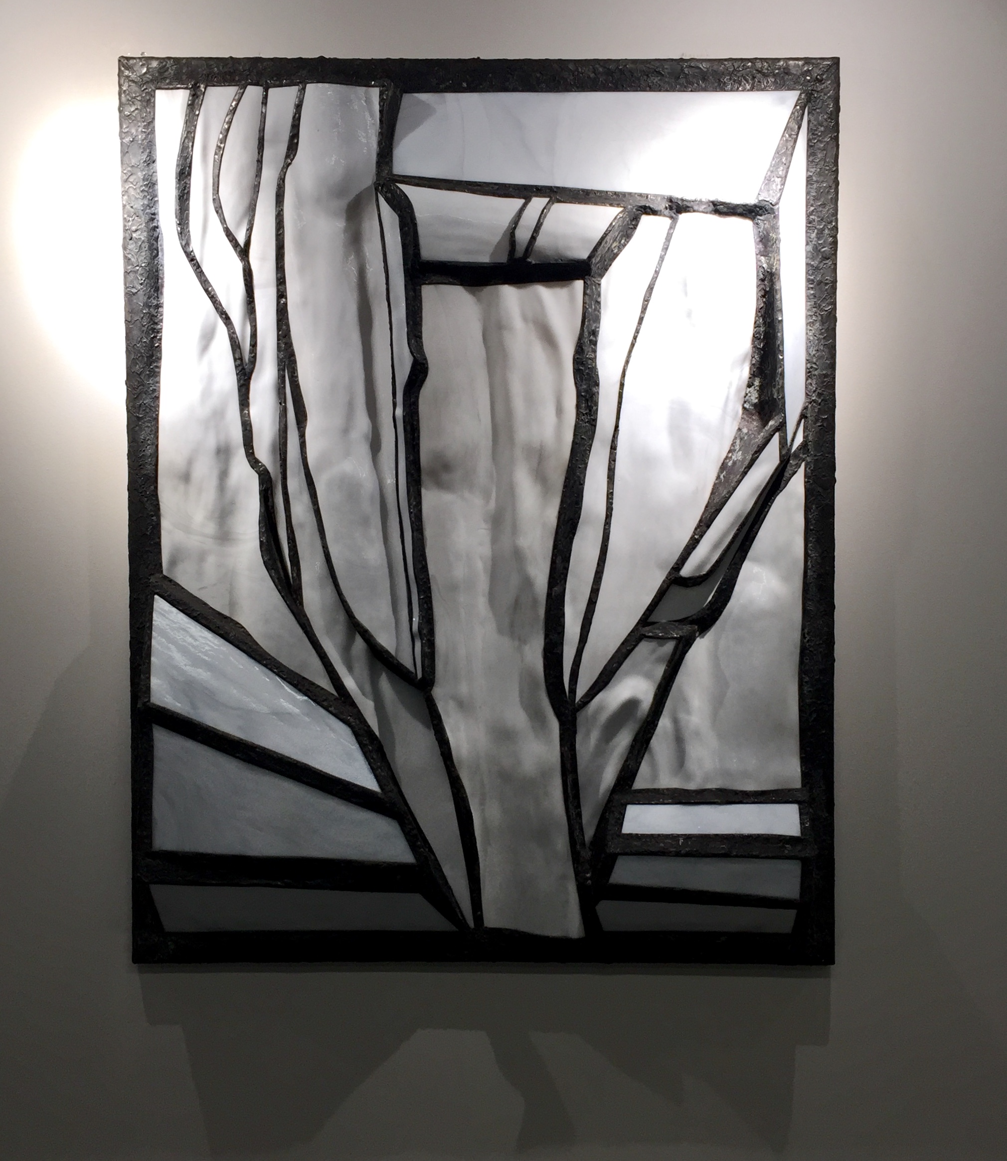 White opaque glass and steel wall sculpture
