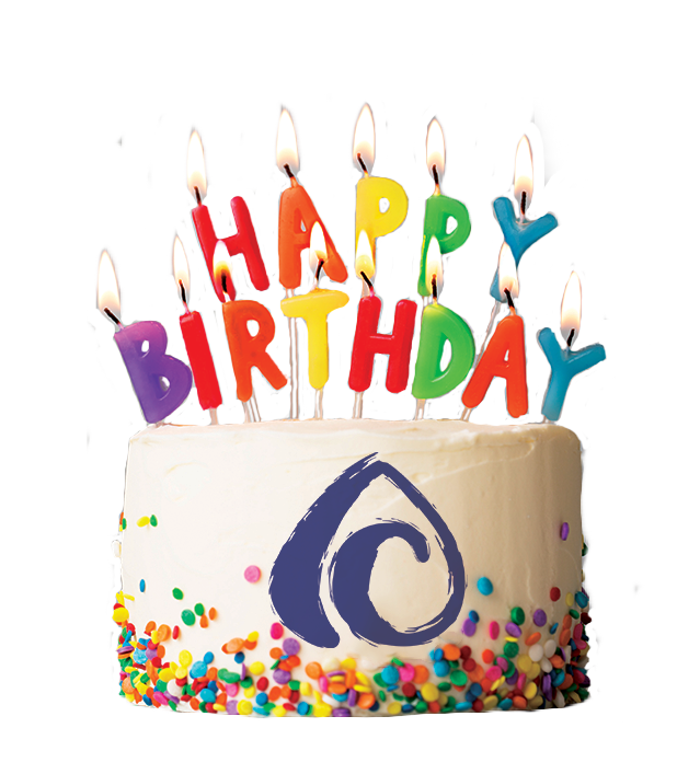 a colorful birthday cake with rainbow colored candles and The Arts Center's Swirl A-C logo