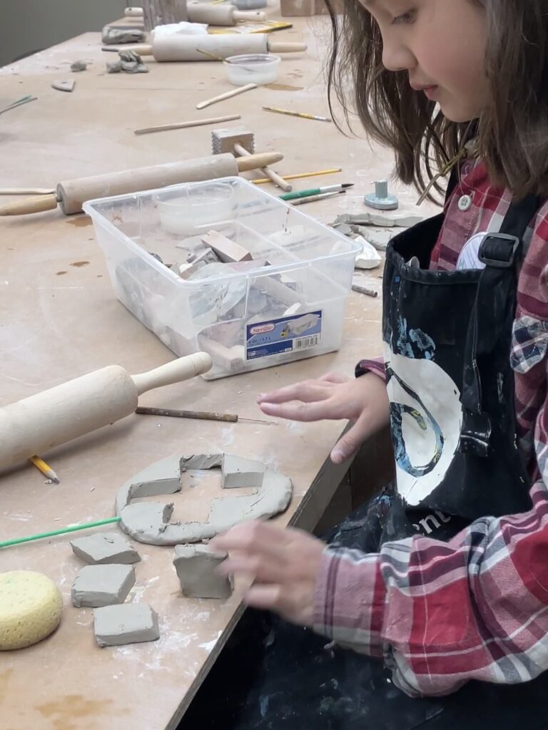 Young child working with clay